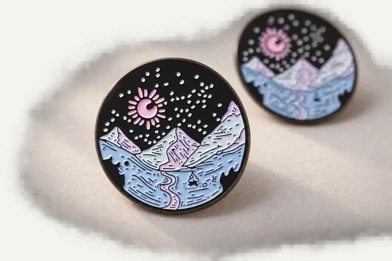 Editorial finished-pin presentation of the mountain design.