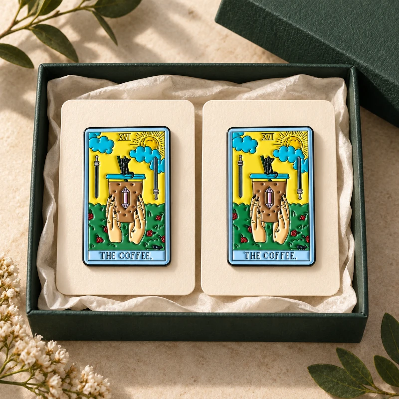 Editorial presentation of colorful coffee pins on blank cards in a green box.